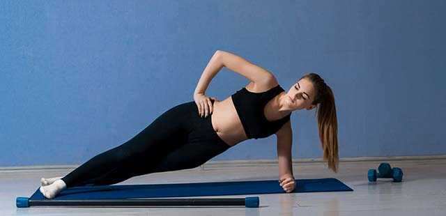Side plank with dumbbell raises