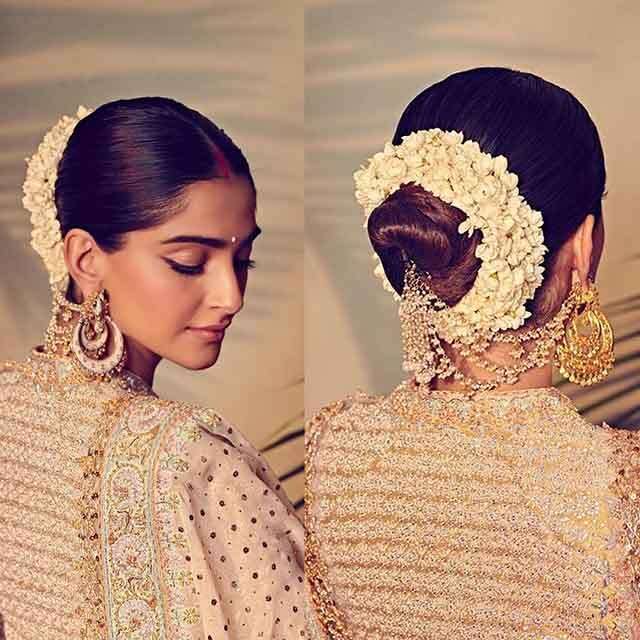 Sonam Kapoor favours a fuss-free saree giving a complete traditional touch  with a big bun