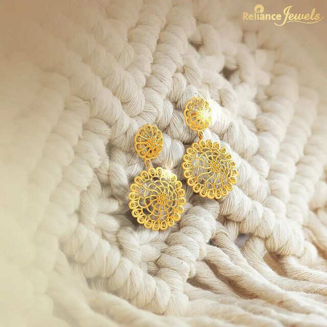 Reliance Jewels - This unique design displays intricate gold craftsmanship  inspired from trendy aesthetics and has ultra-modern sense of styling.  These whimsy earrings are crafted in 14KT gold and encrusted with  high-quality