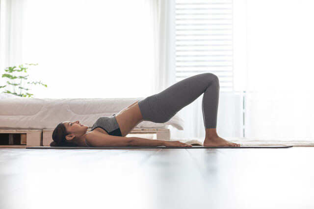 Half Bridge Pose Exhale and lay down flat on your... - The Exercist