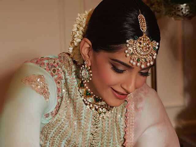 Image of Young Indian lady in ethnic bridal wear, jewelry and  make-up-RF349989-Picxy