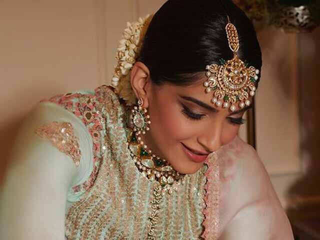 Image of Young Indian lady in ethnic bridal wear, jewelry and  make-up-RF349989-Picxy