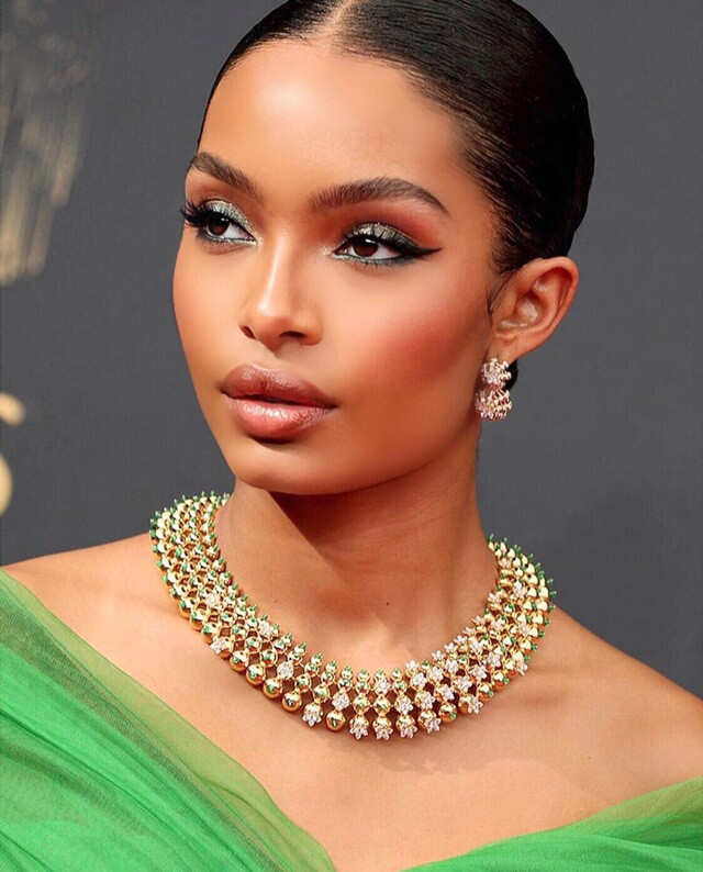 Yara Shahidi wearing Cartier necklace and matching earrings 