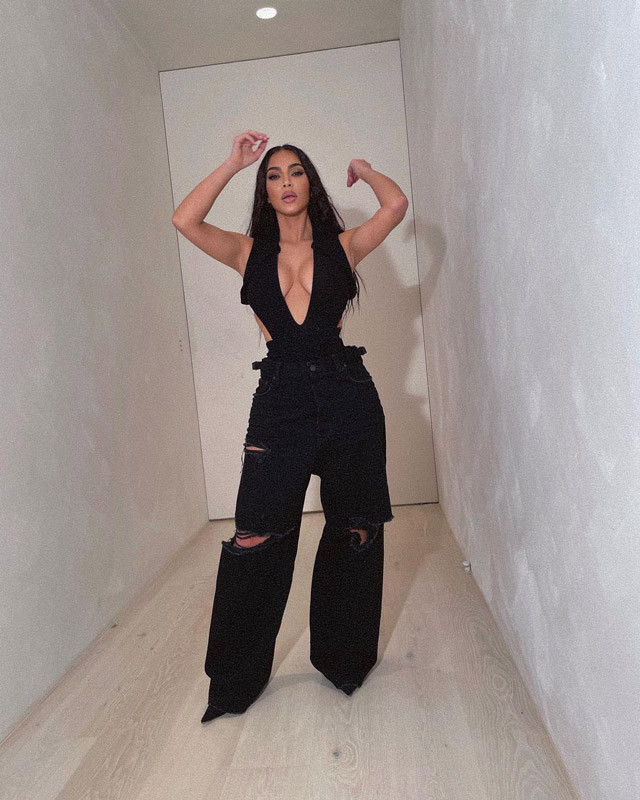 Kim Kardashian wears a Maximilian Spring 2022 bonded scuba bodysuit and  paired it with black ripped baggy jeans, more than likely Balenci