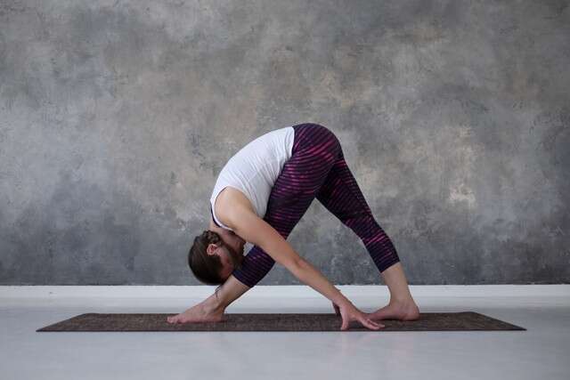 Parsvottanasana or Side Stretch with Upright Modification Yoga for Heartburn