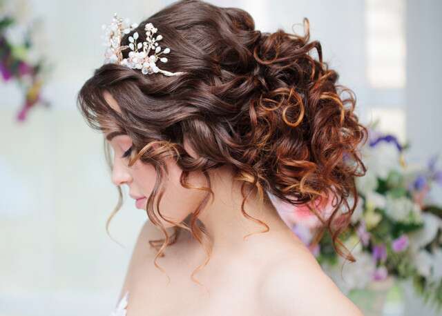 Updo in messy bun Hairstyles For Indian Brides