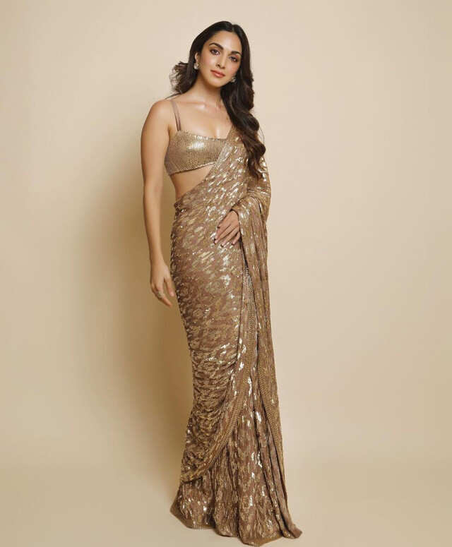 Kajal Aggarwal shines in her heavy embellished gold saree and