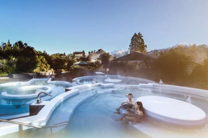 New Zealand hot pools - Hanmer Springs couple in pools PC_ Hurunui Tourism