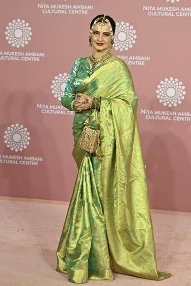 Rekha in green saree and jewellery during NMAAC launch event.