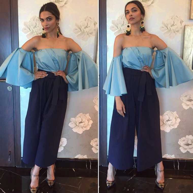 Deepika Padukone Bringing two trends together, Deepika wore an off-shoulder Cord top with Tome culottes at a recent event. Statement earrings from Mercedes Salazar added some sparkle to her look.