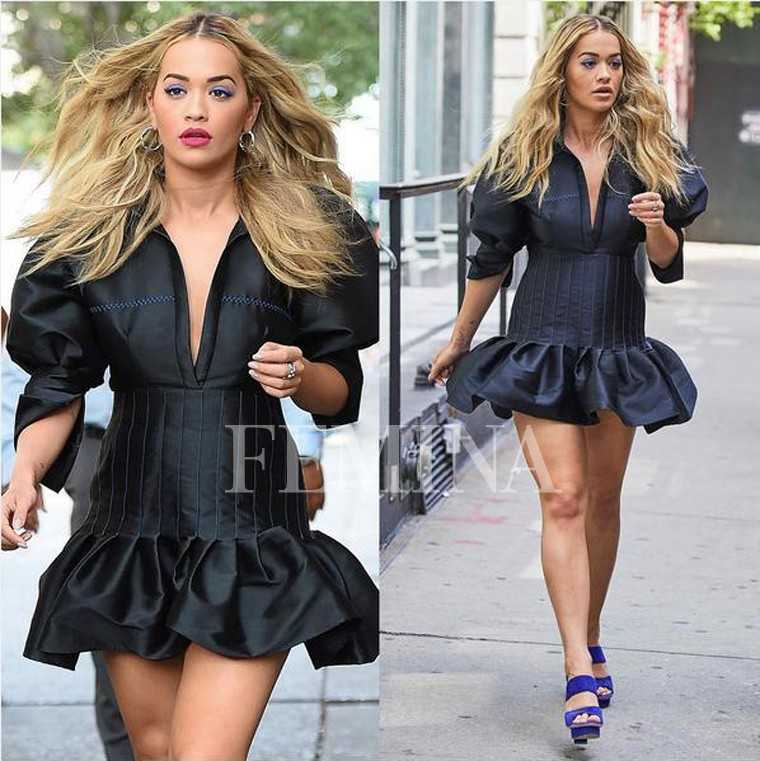 Rita Ora is giving us strong Beyonce vibes in a flouncy Ellery dress. Her gorgeous blowout, pop eye shadow and electric blue heels elevate the look.