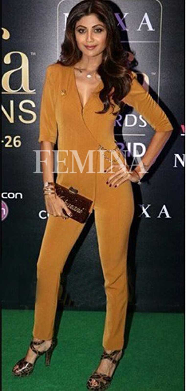 The ever-so-stunning, Shilpa Shetty made an appearance at a recent event pairing her Karn Malhotra suit with a Maharani monogrammed jewel tone clutch.