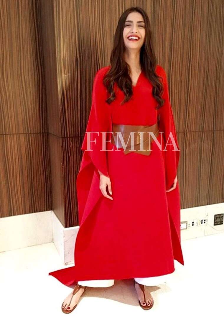 Sonam Kapoor: Sonam paired her bright red Payal Khandwala dress with tan thong sandals and a matching waistbelt. The cascading curls and the red lip finished her look.