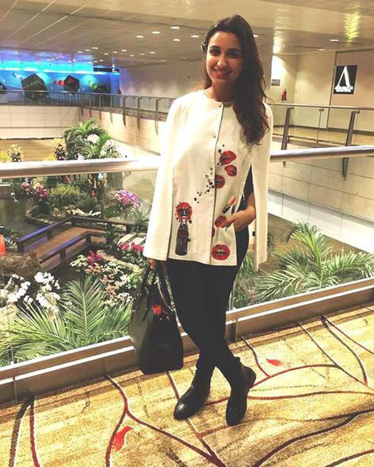 Parineeti Chopra knows how to travel in style. She let’s her Shahin Mannin statement cape do all the talking.