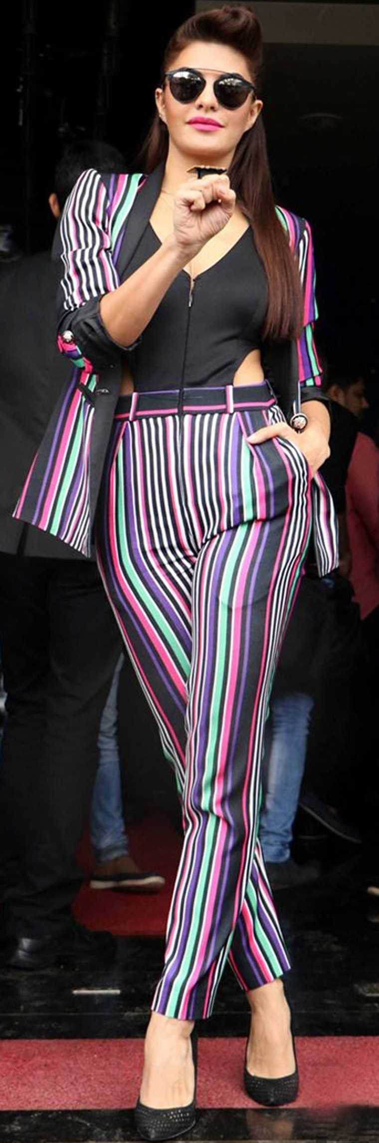 JACQUELINE FERNANDEZ: Who says a striped suit has to be boring. This playful trouser-suit set from Karn Malhotra gives pinstripes a new name.