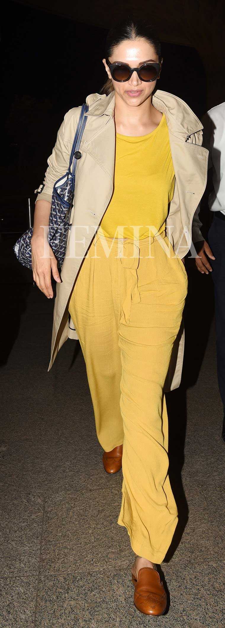 Deepika in camel trench, tan loafers