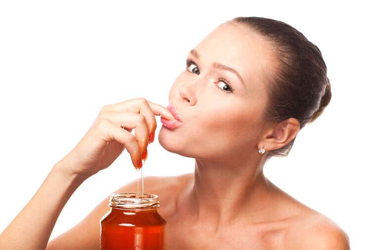 woman eating honey