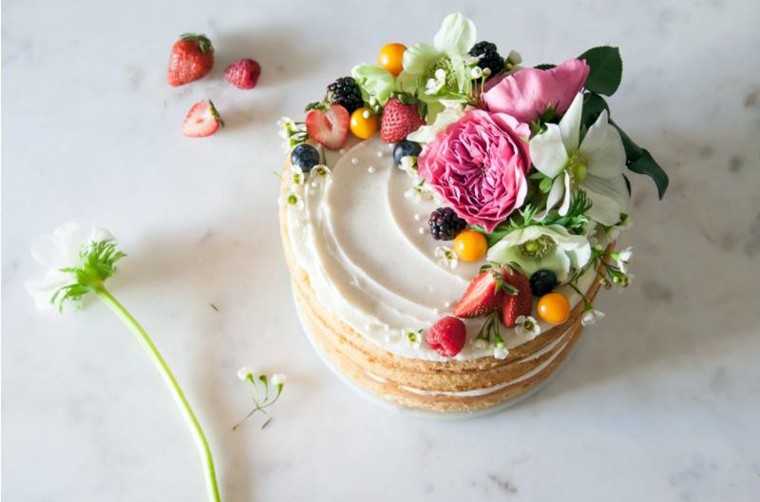 Gorgeous fresh fruit and flower naked wedding cake at www.brit.co