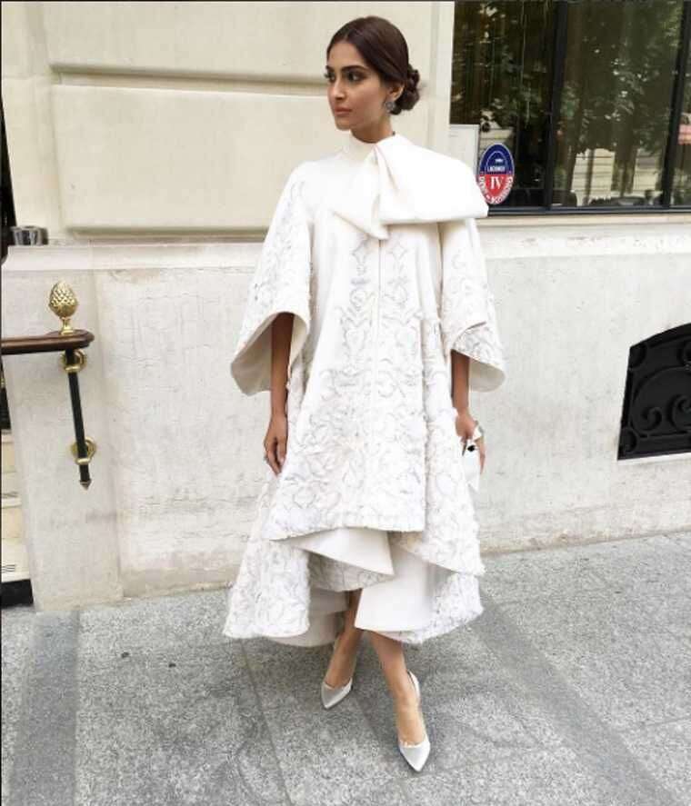 SONAM KAPOOR We wouldn’t normally think that such a voluminous number would work but Sonam looked super stylish in this Ralph & Russo asymmetric coat dress. The hint of ankle and wrist as well as her pulled-back hair and makeup look ensured she channell