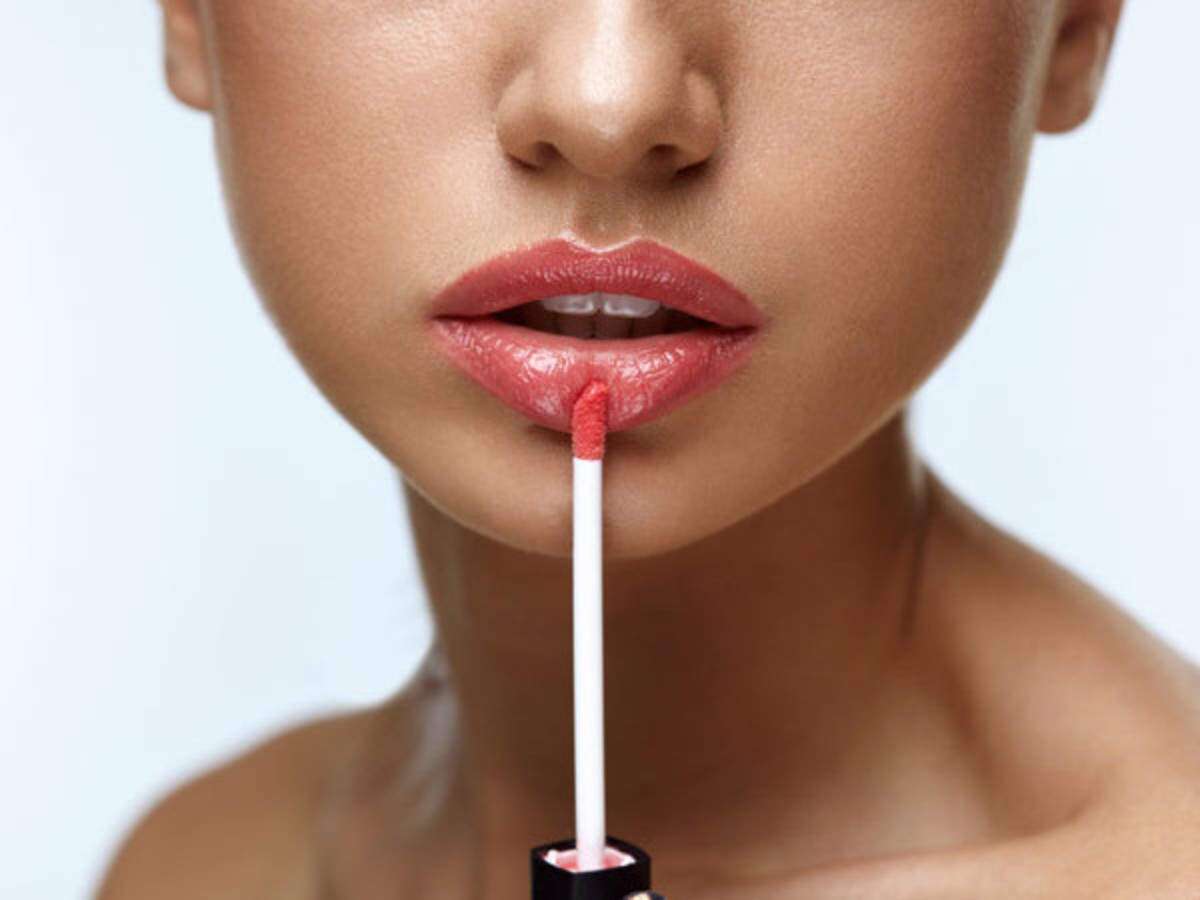 applying lip gloss
