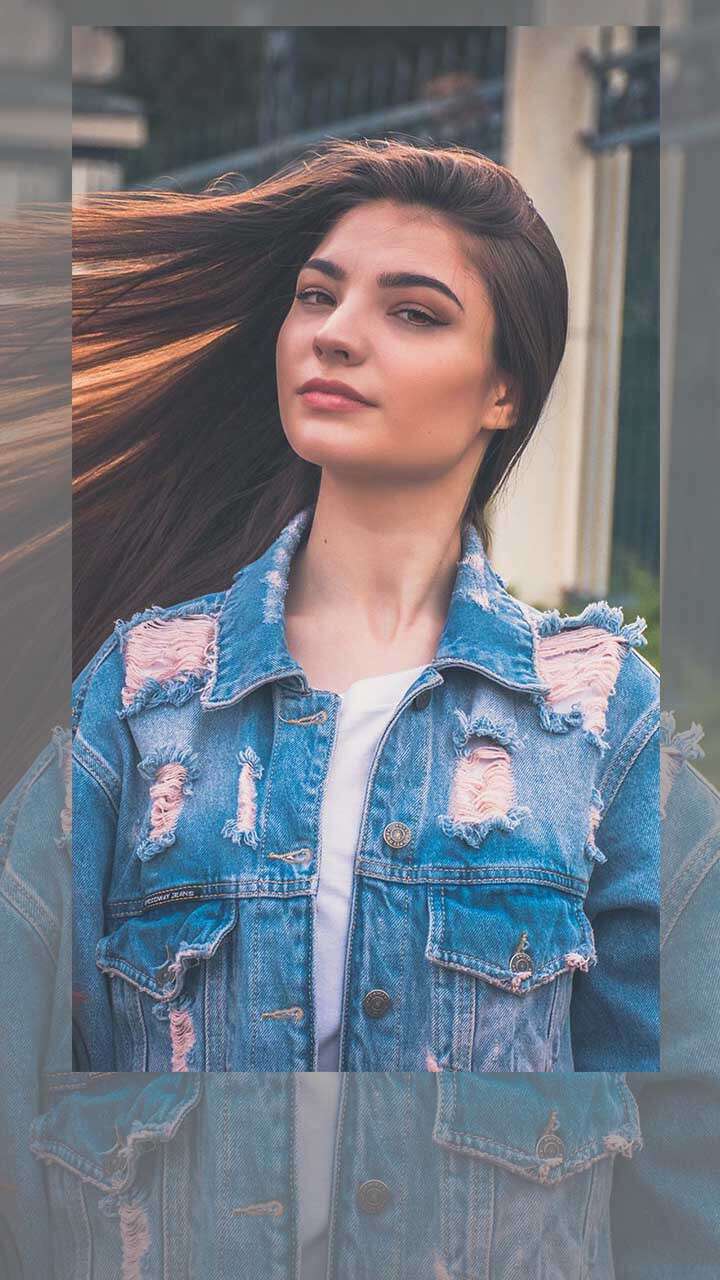 A Woman in Denim Jacket Smiling and Posing · Free Stock Photo